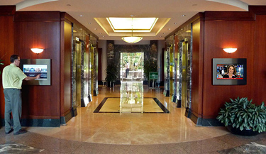 semi-recessed TV as digital signage in building lobby