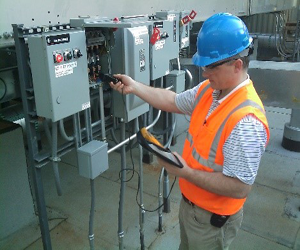 Photo of project meember checking data readings