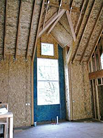 Example of SIPs used for wall and roof panels in a dormer with truss joist framing