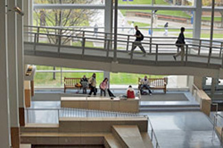 Winona State University interior stairs and halls constructed in dynamic circulation patterns with a 2 story wall of windows